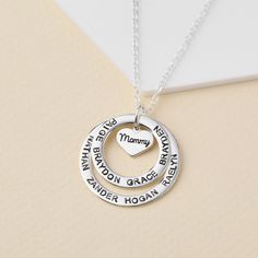 "This necklace is a meaningful and sweet gift for grandma, with her being in centre on a heart charm and grandkids' names surrounding her. A perfect gift for Grandma on any occasion. PRODUCT INFO * Materials: 925 sterling silver with 18K yellow gold or rose gold plate options. * Small ring measures approx. 3/4\" (20mm). Big ring measures approx. 1\" (26mm). Heart charm approx. 0.37\" x 0.32\" (9.8 x 8.5mm) * WORD LIMIT: Small ring: 4-5 words / Big ring: 6 words. Date is counted as 2 words. * By Mother's Day Heart Necklace Gift For Mom, Mother's Day Gift Heart Necklace With Round Pendant, Charm Necklaces With Names For Birthday And Mother's Day, Mother's Day Birthday Name Necklaces, Name Necklaces For Birthday And Mother's Day, Mother's Day Heart Necklace With Round Pendant, Personalized Name Charm Necklaces, Personalized Gift Round Pendant Necklace, Personalized Heart Necklace For Mother's Day