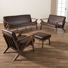 a living room filled with furniture on top of a hard wood floor