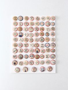 a bunch of buttons that are on top of a piece of paper