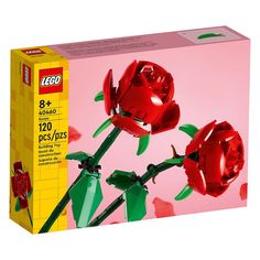 a lego box with two red roses in it