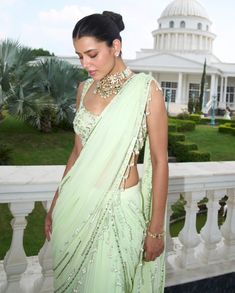 Transform your style with this lime green pre-stitched sari, featuring a sequins-embroidered palla adorned with playful tassel detailing at the end. Paired with a matching embroidered blouse showcasing a broad neckline and stylish cut-out detailing at the waist, this ensemble perfectly blends contemporary flair with traditional charm, making it ideal for special occasions and celebrations. Indian Bridesmaids, Contemporary Embroidery, Charm Making, Feminine Beauty, Embroidered Blouse, Modern Woman, Lime Green, Contemporary Style, Your Style