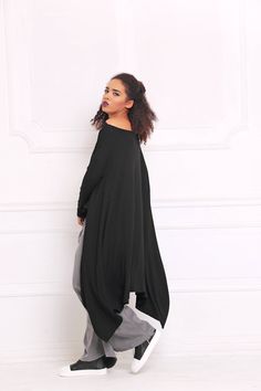 "Black Tunic Top, Asymmetric Tunic, Off Shoulder Top 🌟 Every order is sent out worldwide with EXPRESS 2-3 days delivery 🌟 Easily customizable Comfortable and the ideal gift idea Fitting every body type, suitable for every occasion Easily combined with accessories and other articles of clothing Adeptt Fashion is designed to flatter every body type and fit numerous occasions. We focus on the versatility of each model to make it a perfect match for your favorite accessories and wardrobe pieces! ? Flowy Long Sleeve Lagenlook Blouse, Lagenlook Flowy Long Sleeve Blouse, Oversized Blouse With Asymmetrical Hem For Layering, Oversized Asymmetrical Hem Blouse For Layering, Oversized Lagenlook Blouse For Fall, Oversized Tunic Lagenlook Blouse, Lagenlook Oversized Tunic Blouse, Oversized Batwing Sleeve Tunic In Lagenlook Style, Oversized Lagenlook Tunic With Batwing Sleeves