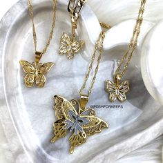 DESCRIPTION: Part of our exclusive "The Butterfly Effect Collection", this gorgeous high polish 18K Gold Plated Butterfly Kiss Choker is a must have piece! Perfectly placed on a classic Figaro chain, this butterfly charm is embedded with the highest quality of baguette cut Cubic Zirconia crystals that shines like crazy in any kind of lighting! MATERIAL: 18K Gold Plated over Stainless Steel. Hypoallergenic, Tarnish Free and Water Resistant. LENGTH: 16 inches. Pendant: 0.5 in. Matching Butterfly A Kiss Necklace, Butterfly Anklet, The Butterfly Effect, Butterfly Lace, Charm Anklet, Butterfly Collection, 18k Gold Necklace, Lace Necklace, Butterfly Kisses