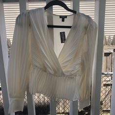 I Bought It For Christmas , Never Used . Original Price $80 , I Paid $40. I’m Selling Because I Loose Some Weight And I Dont Like The Way It Looks On Me. It Is Very Pretty , For A Wedding , Babyshower , Birthday Is Really Beautiful. Elegant V-neck Holiday Tops, Holiday V-neck Blouse For Night Out, Spring Pleated Blouse For Night Out, Chic Pleated V-neck Top, Pleated Tops For Evening Wear In Fall, Pleated Blouse For Night Out In Spring, Spring Blouse With Pleats For Night Out, White Long Sleeve Top For Date Night, Chic V-neck Holiday Tops