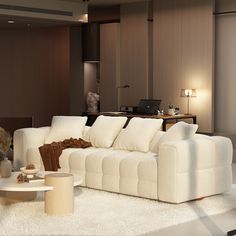 a living room filled with furniture and a white rug