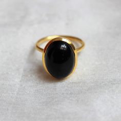 D E T A I L S - Material: 925 Sterling Silver Stone: Black Onyx Stone Shape: Square The fit: True to US ring size Finish: Smooth and gold plated to a high shine S H I P P I N G & P R O D U C T I O N - My current production time is 2-6 business days, which means after those days are up, your order ships! I make everything custom to order, by hand, but I promise you it's worth the wait! R U S H - M Y - O R D E R - If you're in a rush to get your pretty new pieces, please send me a message and Oval Black Enamel Rings For Anniversary, Oval Onyx Rings For Anniversary, Oval Onyx Cabochon Ring, Oval Cabochon Onyx Ring, Oval Onyx Ring With Cabochon, Classic Black Oval Cabochon Ring, Elegant Black Oval Dome Ring, Classic Oval Black Enamel Ring, Classic Black Enamel Oval Ring