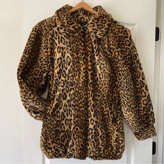 Amazing Vintage Faux Fur Coat Size 1x By Dennis Basso In A Leopard Animal Print. Pointed Collar, Heavy Padded Structured Shoulders, Loose Sleeves With Banded Bottom, Elastic Hemline Like A Bomber Jacket, Hook And Eye Closure. Excellent Condition With No Flaws Of Note. Very Well Made; Chic And Timeless Style. Approximate Measurements: 25” Pit To Pit 31” Total Length Leopard Print Faux Fur Coat, Vintage Faux Fur Coat, Wife Style, Dennis Basso, Mob Wife, Mob Wives, Loose Sleeves, Leopard Animal, Faux Fur Coat