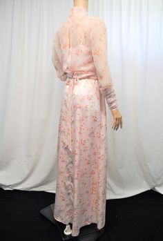 "Vintage 1960s 1970s pink floral print floor length gown. This floor length gown appears to have been custom made either by a skilled home seamstress or one of the many professionals that populated this area during the time period. The gown is made in matching satin and chiffon fabrics. The gown itself has a straight across bodice with satin ribbon spaghetti straps and a 5 panel A line skirt. The over piece is chiffon that opens in the back closing at the banded collar in the back and at the wai Pink Fitted Sheer Gown, Pink Fitted Gown With Sheer Details, Vintage Floral Print Maxi Dress For Party, 1970s Style Spring Wedding Dress, Fitted Pink Gown With Floral Print, Full Length Silk Dress For Spring, 1970s Style Wedding Dresses For Spring, Vintage Floral Print Maxi Dress For Wedding, Vintage Floral Print Maxi Dress For Evening