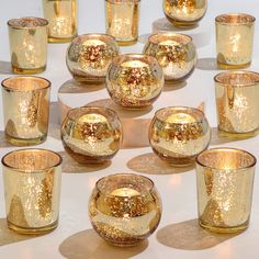 PRICES MAY VARY. Hight QUALITY AND 24PCS ASSORTED CANDLE HOLDER : These charming cute candle holders are made of thick & strong glass, which are durable and not easy to break. Each order will consist of 12pcs Speckled Mercury Glass Votives and 12pcs Bowl Mercury Glass Votives .(Candles Excluded), CUTE SIZE: The ROUND votive tealight candle holder is 2ʺ diameter (top) and 2ʺ height approximately, the regular candle holder is 2.17ʺ diameter (top) and 2.6ʺ height approximately. We recommend to use Gold Votives Wedding Centerpieces, Amazon Candles, Gold Mercury Glass Votives, Gold Wedding Table Decorations, Gold Votives, Gold Votive Candle Holders, Gold Votive Candles, Gold Wedding Centerpieces, Mercury Glass Candle Holders