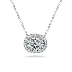 Discover the beauty of our 2 Carat East West Oval Cut Moissanite Floating Halo Slide Pendant Necklace in 18K White Gold over Silver. This oval halo pendant necklace showcases a mesmerizing 2-carat east west oval cut moissanite, expertly cradled within a floating pendant halo. The east-west orientation of the oval moissanite adds a contemporary twist to the women's minimalist necklace, making it a remarkable choice for those who appreciate unique design elements. Suspended from a graceful necklac Dazzling Oval Diamond White Necklace, Oval Diamond White Dazzling Necklace, Oval Brilliant Cut Diamond White Necklace, Diamond White Brilliant Cut Oval Necklace, Dazzling Oval Necklace With Brilliant Cut, Dazzling Oval Brilliant Cut Necklace, Formal Oval Diamond Cut Necklace, Formal Oval Diamond Cut Necklaces, Classic Oval Diamond Necklace With Halo Setting