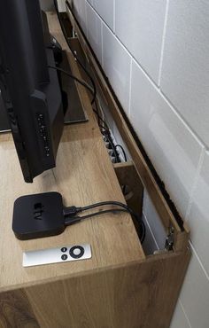 an apple tv sitting on top of a wooden table