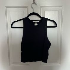 Urban Outfitters Black Cropped Tank Top With Metal Rings On Back. New With Tags. Size Medium. Urban Outfitters Sleeveless Black Crop Top, Black Cropped Top From Urban Outfitters, Black Cropped Tops By Urban Outfitters, Urban Outfitters Fitted Black Tank Top, Urban Outfitters Black Tank Top For Spring, Urban Outfitters Black Casual Crop Top, Trendy Black Urban Outfitters Crop Top, Urban Outfitters Black Cropped Crop Top, Urban Outfitters Black Cropped Top