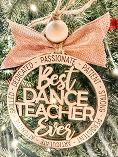 a christmas ornament with the words best dance teacher ever hanging on a tree