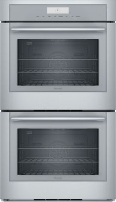 two built in ovens side by side with the door open and one is empty