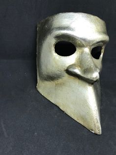 This masquerade mask for men belongs to our collection of historical masks: traditionally they were used in the past centuries in Venice. The name of this mask is Bauta and it was traditionally used by men. It is perfect for any masquerade party, Halloween costume, pro or event in Venice or elsewhere during Carnival. This mask can be gently bent to form to your face and ties in the back with two soft matching ribbons. Since the mask is handmade, your mask could be lightly different from the one Mens Masquerade Mask, Venetian Mask, Venetian Masks, Masquerade Party, Costume Mask, Masquerade Mask, Masquerade Ball, Gold Price, Mask For Kids