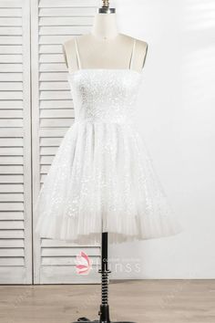 sparkly ivory white glitter sequin short homecoming dress White Glitter Cocktail Dress, White Mini Sequin Dress For Prom, Sequin Dress For Wedding And Prom With Spaghetti Straps, Elegant White Glitter Dress, White Sequin Cocktail Dress For Prom, Summer Prom Dress In Glitter Tulle, White Spaghetti Strap Homecoming Dress, White Mini Dress With Spaghetti Straps For Homecoming, Spaghetti Strap Tulle Mini Dress For Prom