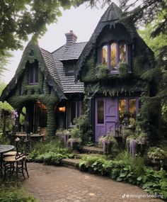 a purple house covered in vines and flowers