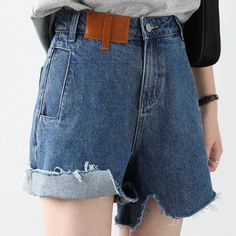 Unleash Your Streetwear Style with Retro Elegance Elevate your fashion game with our Women's Denim Shorts - a perfect blend of retro charm and contemporary style. These Irregularly Cut Blue High-waisted Short Jeans are designed for the modern woman who appreciates a touch of nostalgia in her wardrobe. Key Features: Retro Vibes: Embrace the timeless appeal of retro fashion with these irregularly cut high-waisted shorts, bringing a classic touch to your streetwear ensemble. Comfort Redefined: Crafted from denim cotton fabric, these shorts offer a comfortable and breathable fit. The fabric is skin-friendly, ensuring you stay cool and stylish all day long. Textured Elegance: The retro wash with texture adds depth to the design, giving your shorts a unique and fashionable look that stands out f Denim Blue Short Length Jeans With Belt Loops, Retro Denim Blue Bottoms With Frayed Hem, Wide-leg Denim Blue Jean Shorts With Frayed Hem, Denim Blue Straight Leg Jean Shorts With Belt Loops, Trendy Blue Jean Shorts With Belt Loops, Denim Cutoff Bottoms With Belt Loops, Casual Cutoff Jeans With Belt Loops, Wide Leg Jean Shorts With Frayed Hem, Blue Retro Bottoms With Frayed Hem