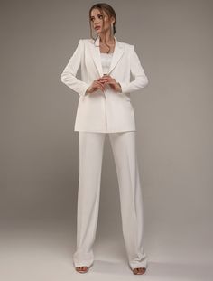 A beautiful wedding outfit can not only emphasize the individual beauty of the bride, but also give confidence, grace, elegance, and a positive mood ✨ 💕 Highlights:   - made of high-quality stretch satin   - available in ivory color  - elegant jacket with button, turn-down collar, and pockets  - straight long sleeves and trousers with high-fit 🔺 Important: The price is for a suit (jacket and pants), the top is not included in the price. If you want to order a top, write to us, we will provide Elegant Tailored Wedding Tuxedo, Elegant Notch Lapel Suit For Wedding, Elegant Tailored Suits For Ceremony, Tailored Elegant Suits For Ceremony, Luxury Notch Lapel Wedding Pantsuit, Luxury Notch Lapel Pantsuit For Wedding, Elegant Wedding Blazer, Elegant Tailored Blazer For Wedding, Luxury Tailored Wedding Suit