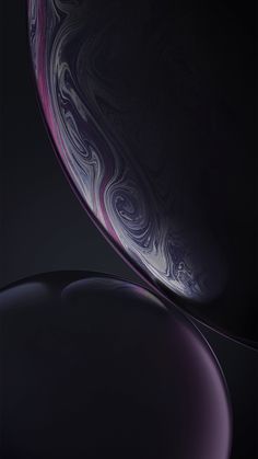 the back side of an iphone xr with purple and blue swirls on it