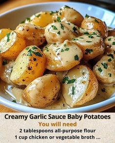 a white bowl filled with potatoes covered in gravy