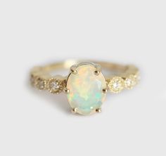 Welo Opal Ring Ethiopian Opal Ring Oval Opal Ring by capucinne Opal Ring With Diamond Accents For Gift, Gift Opal Ring With Diamond Accents, Elegant Ethiopian Opal Ring For Anniversary, Elegant Ethiopian Opal Ring In Oval Cabochon, Elegant Ethiopian Opal Ring Oval Cabochon, Elegant Opal Ring With Center Stone, Elegant Ethiopian Opal Ring, Oval Cabochon, Ethiopian Opal Oval Ring For Wedding, Elegant Ethiopian Opal Oval Rings