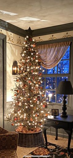 a living room with a christmas tree in the corner