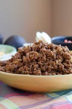 taco meat to freeze for serve in a bowl on a table with other foods