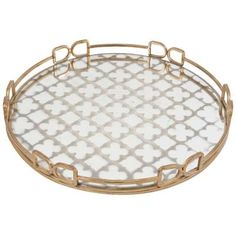 a white and gold tray with an intricate design