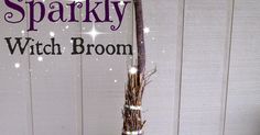 a witch broom sitting on top of a table next to a white wall with the words sparkley written across it