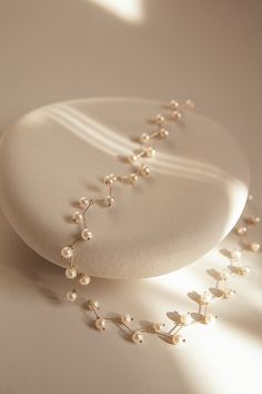 The Astro Floating Pearl Necklace gives the illusion of floating pearls, each necklace we create is meticulously handcrafted using 14k gold filled pins to encase each freshwater pearl. Astro is sure to be a favorite to elevate your daily wear or take your date outfit to another level. Packaged in an elegant plastic-free rensable jewelry box, they make the perfect gift or special treat for oneself.  14k gold-filled components Freshwater 4mm pearls (approx. 42 pearls) Hypoallergenic, suitable for even the most sensitive skin Delivered in a 100% silk jewelry pochette inside a gift box Sustainable magnetic closure jewelry box and customizable card   Please note, as we use only natural pearls, shape and size may vary slightly.  We offer a one year guarantee from the date of delivery and unlimit Delicate Pearl Necklace For Jewelry Making, Yellow Gold Single Strand Pearl Necklace For Wedding, Elegant Pearl Backdrop Necklace, Minimalist Pearl Drop Backdrop Necklace, Delicate Pearl Backdrop Necklace With Charm, Gold Pearl Drop Backdrop Necklace, Gold Backdrop Necklace With Pearl Drop, Gold Pearl Chain Backdrop Necklace, Gold Single Strand Pearl Necklace For Wedding