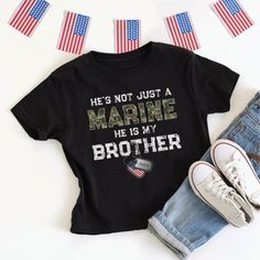 This patriotic He's / She's Not Just A Marine, He / She Is My Brother (Sister, Son, Daughter, Dad, Mom, etc.) kid's t-shirt with personalized Marine name on US flag dog tags is designed for a proud military family member - perfect for boot camp graduation, going away or welcome home party! **Designed by a proud Air Force Mom!** Makes a great gift for special occasions like birthday, holidays, Mother's Day or Father's Day. Easily customize for male or female Marine, dog tag name, and family relationship - and you can choose adult, kids, and baby sizes! Other armed forces branches are available in my Zazzle storefront (click on "FigLilyCo--Military" shop link in the right-hand corner of this page, and again on my shop name there, and head to the "T-Shirts & Clothing" category to see more! Cu Marine Sister Shirts, Usmc Graduation, Marine Dog, Marine Sister, Welcome Home Party, Marines Boot Camp, Military Dog Tag, Boot Camp Graduation, Military Shop