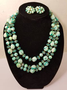 "++ GORGEOUS JEWELRY SET ++ Stunning teal blue 3 strand neckalce Matching clip on earrings In excellent vintage condition Marked Hong Kong Adjustable closure on the necklace 19 inches total at the longest Earrings measure 1x1\" Let's be friends! https://www.facebook.com/TheGirlSaidYesVintage" Mid-century Handmade Wedding Jewelry, Retro Round Bead Jewelry For Parties, Retro Round Beads Jewelry For Party, Blue Beaded Retro Jewelry, Retro Blue Beaded Jewelry, Retro Beaded Jewelry For Party, Retro Beaded Party Jewelry, Retro Green Jewelry For Vintage Events, Retro Blue Jewelry For Party