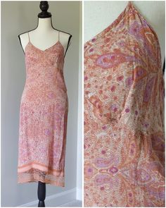 Elevate your wardrobe with our Pink Paisley Paradise Passport Midi Slip Dress adorned with delicate lace trim. This stunning piece combines vibrant paisley prints with a flattering midi silhouette for a perfect blend of style and comfort. Whether you're strolling through the city streets or attending a garden party, this dress is sure to turn heads. Crafted with high-quality materials, it offers both elegance and versatility for any occasion. Embrace the charm of paisley and lace and make a statement with our Passport Midi Slip Dress, a must-have addition to your collection. Pink Lace Trim Slip Dress For Daywear, Light Pink Lace Slip Dress, Paisley Slip Dress, Pink Floral Print Midi Slip Dress, Slip Dress With Lace, V-neck Midi Dress With Paisley Print For Beach, Dress With Lace Trim, Midi Slip Dress, Pink Paisley