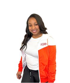 Red and White Delta Windbreaker. Delta Sigma Theta on left side and Crest on the back.  Runs true to size. Model is wearing a small.  *May appear orangish in the picture but is red. Delta Sigma Theta, Minneapolis, Gender Neutral, Red And White, Jackets & Coats, Adult Outfits, Bathing Beauties, Models, Music Clothes