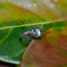 "Labradorite ring \"Daisy\" is created from Sterling Silver absolutely by hands and features a beautiful green-blue Labradorite cabochon in the center. Design of the ring is inspired by Mother nature. The master made tree brunch texture and have added few leaves and flowers. It can be a choice if you are looking for a gentle Labradorite engagement ring. Enjoy the finer details and glow of the magnificent and powerful Labradorite! DETAILS - 925 Sterling Silver - Oxidized antique finishing - Amazi Vintage Labradorite Gemstone Rings, Elegant Silver Labradorite Crystal Ring, Silver Labradorite Nature-inspired Jewelry, Unique Silver Labradorite Ring, Labradorite Engagement Ring, Silver Bohemian Labradorite Ring, Etsy Wedding Rings, Labradorite Ring, Vintage Engagement