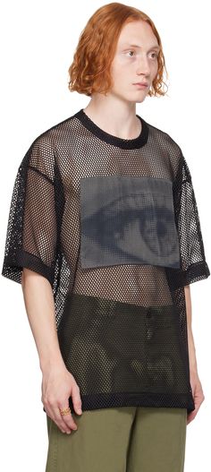 Semi-sheer mesh T-shirt. · Crewneck · Graphic patch at chest · Dropped shoulders Supplier color: Black Black Mesh Fishnet Top, Crew Neck Mesh Top With Graphic Print, Summer Mesh T-shirt With Graphic Print, Graphic Print Crew Neck Mesh Top For Streetwear, Crew Neck Mesh Top With Graphic Print For Streetwear, Black Graphic Print Mesh Top With Crew Neck, Black Mesh Top With Graphic Print Crew Neck, Mesh Graphic Print Short Sleeve Top, Graphic Print Mesh Top With Short Sleeves