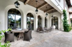 an outdoor dining area with chairs and tables