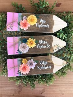 three wooden pencils with flowers on them