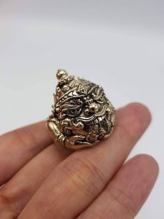 Beautifully made Thai amulet Phra Rahu Ring , by Portan Koly Anomo.  Phra Rahu will bring up your downfall faith, ward away dangers and prevent curses and black magic, keep protection. Those who have difficult or many obstacles in life should worship Phra Rahu, as he will make your life, your career smoother and bring success to you. Free size, adjustable ring. Spiritual Carved Brass Jewelry, Bronze Pendant Jewelry For Blessings, Carved Amulet Jewelry For Collectors, Bronze Carved Spiritual Jewelry, Bronze Spiritual Hand-cast Jewelry, Spiritual Hand-cast Bronze Jewelry, Spiritual Jewelry Locket For Blessing, Spiritual Locket Jewelry For Blessing, Collectible Spiritual Jewelry Ring