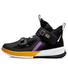 The Nike LeBron Soldier 13 EP 'Lakers' is a bold and stylish sneaker that is perfect for any activity. It features a traditional Magic Strap design, a daring color-blocking design, and James' personal logo on the upper. The black and white-university gold colorway is inspired by the Lakers, James' team. The rubber sole ensures durability and comfort, making it perfect for any activity. Whether you're playing basketball or just running errands, the Nike LeBron Soldier 13 EP 'Lakers' is the perfect sneaker. (SNKR/Men's/High Top/Basketball/Lebron James/Gift Recommend) Breathable High-top Custom Sneakers For Training, Nike Custom Sneakers With Contrast Sole For Sports, Sporty Multicolor High-top Jordan Shoes, High-top Custom Sneakers For Training, Nike Basketball Shoes With Contrast Sole, Nike Basketball Shoes With Contrast Sole For Sports, High-top Basketball Shoes With Contrast Sole For Sports, High-top Basketball Shoes With Contrast Sole, Sports Basketball Shoes With Contrast Sole