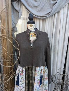 One of a kind....Boho/Hippie/Chic Designs by Me! This Whimsical Dress was repurposed from a Men's size M-38-40 100% Cotton sweater from Structure.  The top is a gray sweater with   a zip neck.  I added the skirt made from scratch out of 1970's curtain fabric along with a soft high quality olive and cream flannel.  I've also added 3 whimsical denim pockets on the bottom half of the dress and one on the left sweater sleeve. The dress from the shoulder to the hem is 39".  From arm pit to arm pit is 22" when flattened.    My name is Christine and my company's name is Mimi's Sewtique, I love to create and make unique items that scream individuality. All my pieces are made with love, passion and are one of a kind.  As with most of my items, this is a shirt I've upcycled, creating eco friendly cl Upcycle Sweater Dress, Upcycled Sweater, Whimsical Dress, Vintage Curtains, Upcycle Sweater, Boho Hippie Chic, Denim Pocket, Eco Friendly Clothing, Sweater Vintage