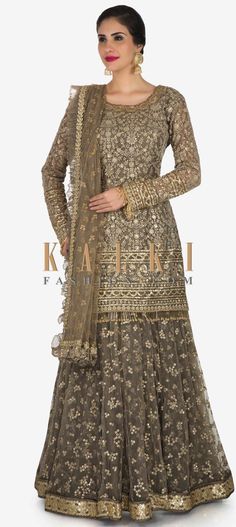 Buy Online from the link below. We ship worldwide (Free Shipping over US$100)  Click Anywhere to Tag Grey skirt suit in silk heavily embellished in resham and sequin embroiderery work only on Kalki You can nail your style single time if you go for this grey skirt suit. The short kurti suit is featured in silk fabric and is heavily embroidered with resham and scattered sequin embroidered work. The grey skirt with the much-needed flare is intricately constructed sequin floral motifs all over. What Skirt And Kurti Indian, Short Kurti With Skirt, Short Kurti With Lehenga, Pooja Mishra, Grey Skirt Suit, Kurti Suit, Designer Kurti Patterns, Short Kurti, Pakistani Wedding Outfits