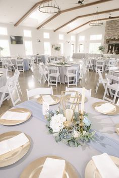 the tables are set with place settings and plates for guests to sit down at them