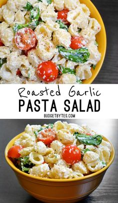 pasta salad with tomatoes, spinach and cheese in a yellow bowl on a black table