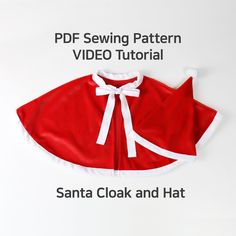 a red and white dog coat with the words santa clack and hat on it