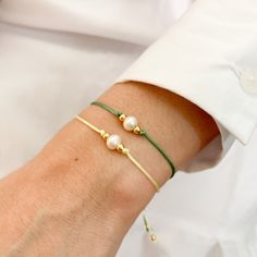 Tiny Freshwater Pearl Bracelet, a cute and minimal design really great for everyday wear and support . Fashion forward delicate and essential! This bracelet is adjustable with macrame knot to fit almost every wrist size. Please choose color of string in options. M A T E R I A L S: * Beads 14K Gold Plated * Freshwater Pearl * Cotton cord SIZE * Pearl: 8mm * Beads: 3.2mm aprox * Bracelet is adjustable 8 -12 ft C R A F T S M A N S H I P ∙ & ∙ L O V E: * Hand-made by me * Happiness guarantee: we Cheap Pearl Bracelets With Tiny Beads, Cheap Minimalist Beaded Bracelet For Best Friend Gift, Cheap Minimalist Jewelry With Tiny Beads, Dainty Adjustable Green Pearl Bracelet, Minimalist Adjustable Beaded Bracelet For Bridesmaids, Adjustable Minimalist Beaded Bracelet For Bridesmaids, Handmade Minimalist Pearl Bracelet For Everyday, Minimalist Handmade Pearl Bracelet For Everyday, Adjustable Dainty Pearl Bracelet