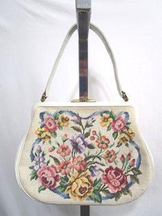 Vintage 50's White Handmade in Austria Petit Point Floral Needlepoint Handbag The Righteous Find - Quality, Stylish and Affordable Wears for the Body and Home Shipping Info: Please pay within 3 days of auction close. I will ship worldwide, but I will not falsify any customs documents. I will accept returns. This comes from a non-smoking home. Please check measurements before you bid. Shipping normally will include a tracking number (delivery confirmation). Please let me know if you have any ques Vintage White Rectangular Bag, White Vintage Rectangular Bag, White Rectangular Vintage Bag, Vintage White Handheld Shoulder Bag, Vintage Cream Bags With Detachable Handle, Vintage Cream Bags For Vintage Events, Vintage Rectangular Bags For Luncheon, Vintage White Shoulder Bag For Daily Use, Vintage Formal Shoulder Bag For Spring