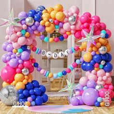 an arch made out of balloons and stars