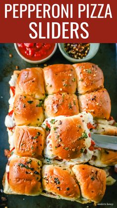 pepperoni pizza sliders on a baking sheet with the title overlay that reads, how to make pepperoni pizza sliders